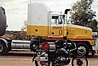 Australia, Northern Territories_my motorcycle BMW R100GS seems like a fly, in front of a so called 'road-train'_my trip 'around the world' by motorcycle 1995-96_Jochen A. Hbener